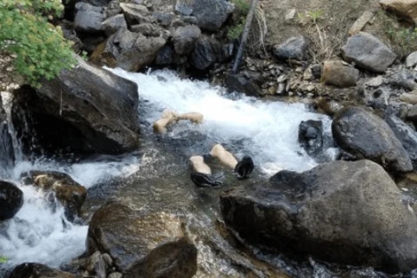 Student practices cold water training at First Circle Camp.